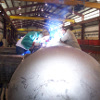 Two workers welding in the shop